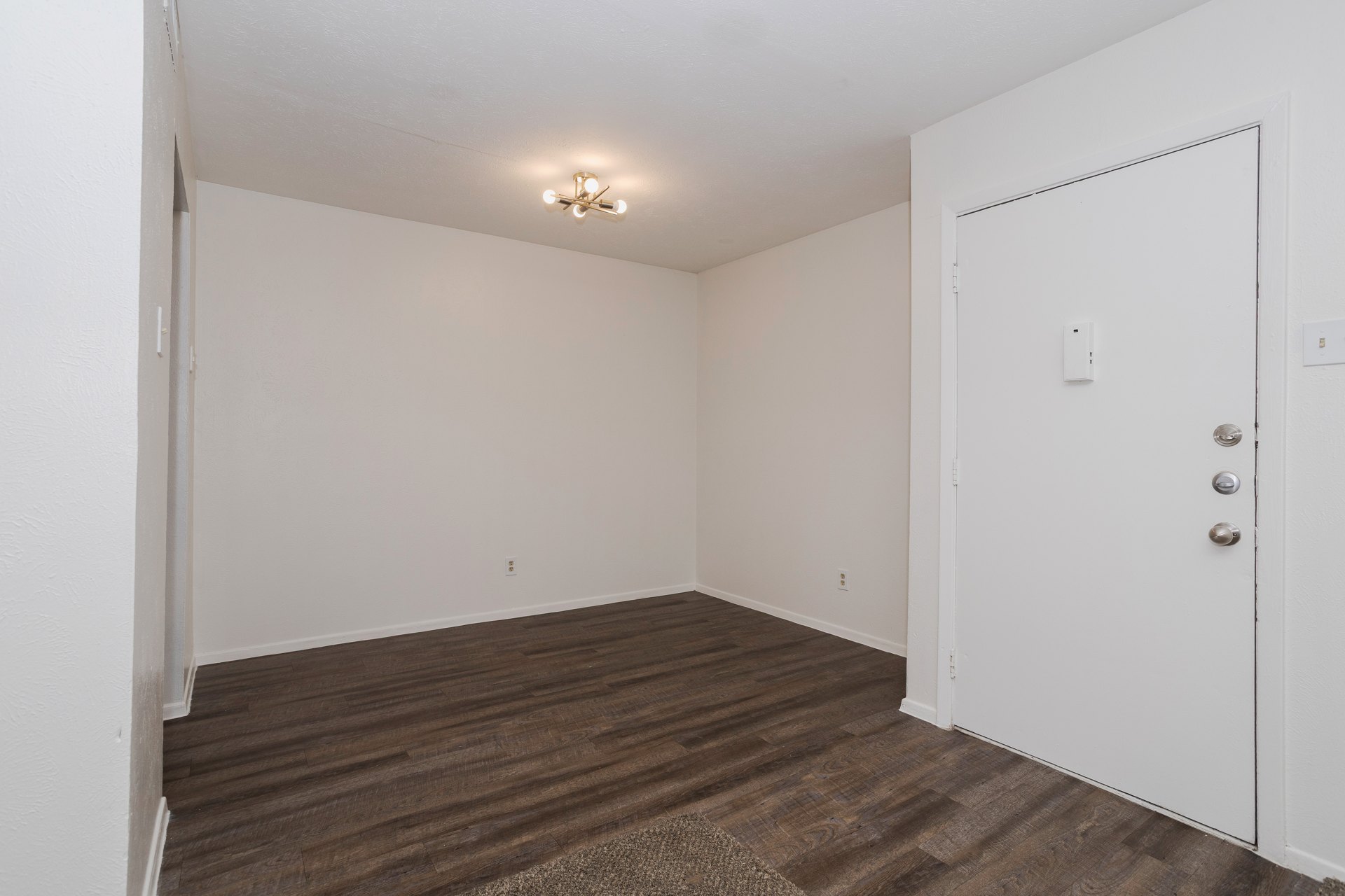 Apartment living area with vinyl flooring at Josey Place